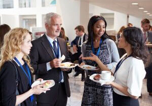 Professionals networking and chatting at a business event